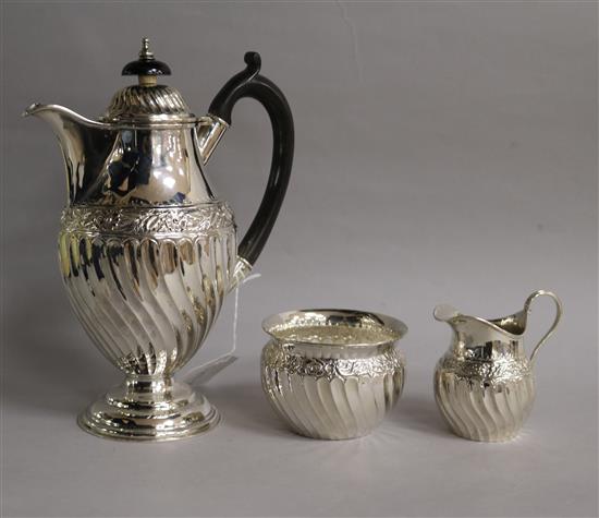 A Victorian silver three piece tea set comprising hot water pot, cream & sugar, Thomas Hayes, Birmingham, 1891889, gross 14 oz.